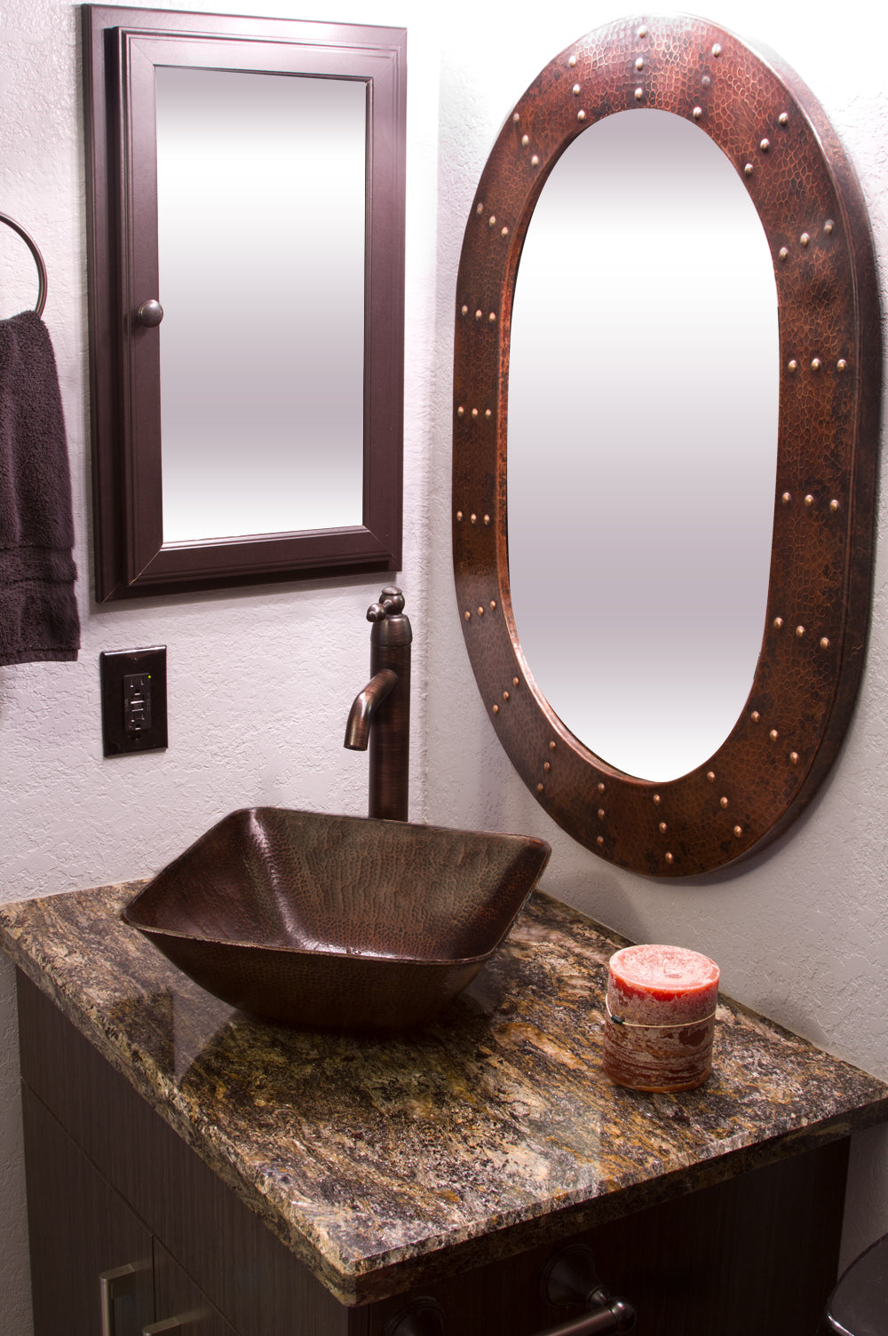 Installation Image of Premier Copper Products 35" Hand Hammered Oval Copper Mirror with Hand Forged Rivets, MFO3526-RI