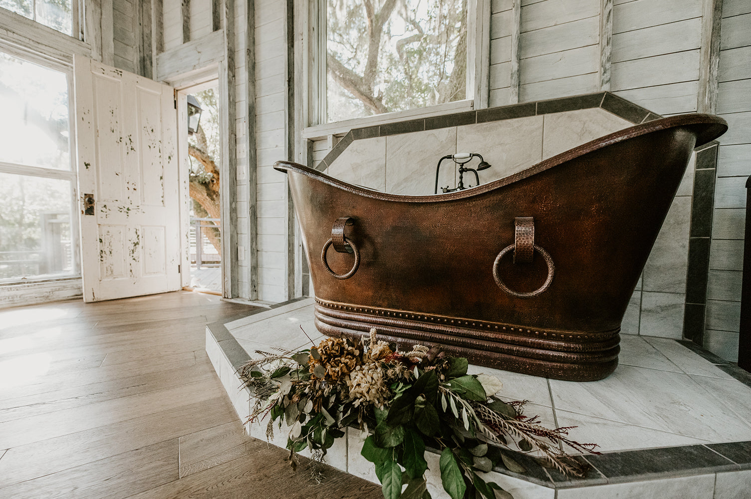 Installation Image of Premier Copper Products 67" Hammered Copper Double Slipper Bathtub With Rings, BTDR67DB