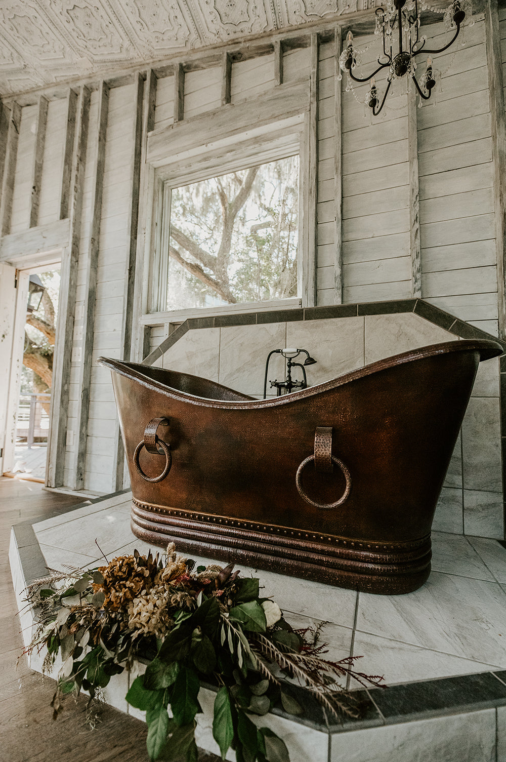 Installation Image of Premier Copper Products 67" Hammered Copper Double Slipper Bathtub With Rings, BTDR67DB