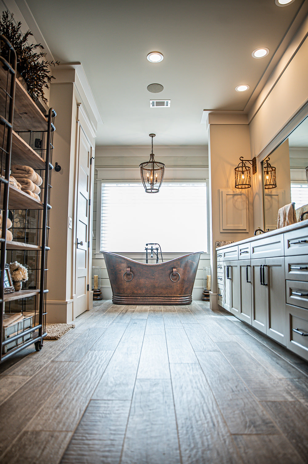 Installation Image of Premier Copper Products 67" Hammered Copper Double Slipper Bathtub With Rings, BTDR67DB