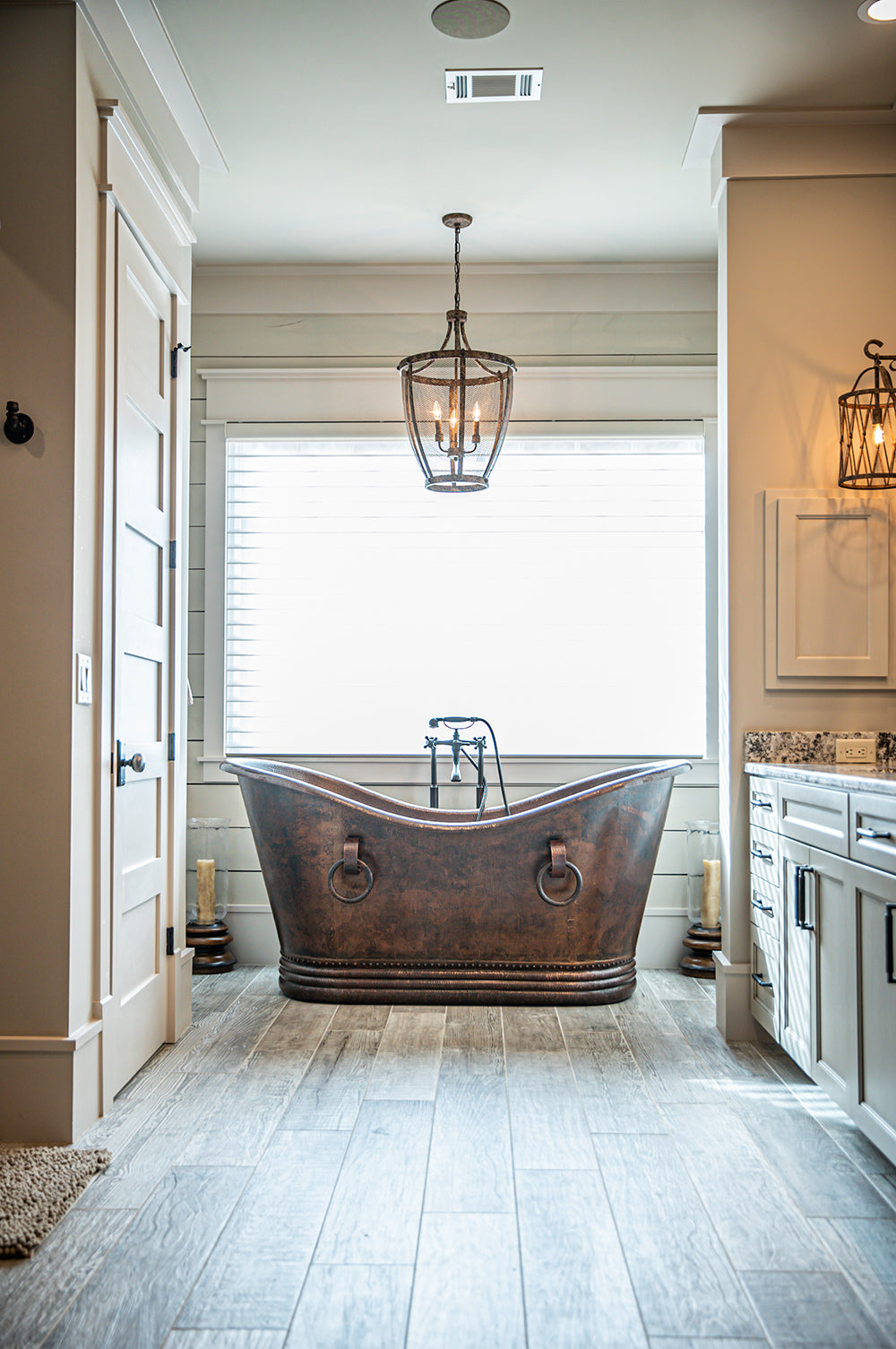 Installation Image of Premier Copper Products 67" Hammered Copper Double Slipper Bathtub With Rings, BTDR67DB