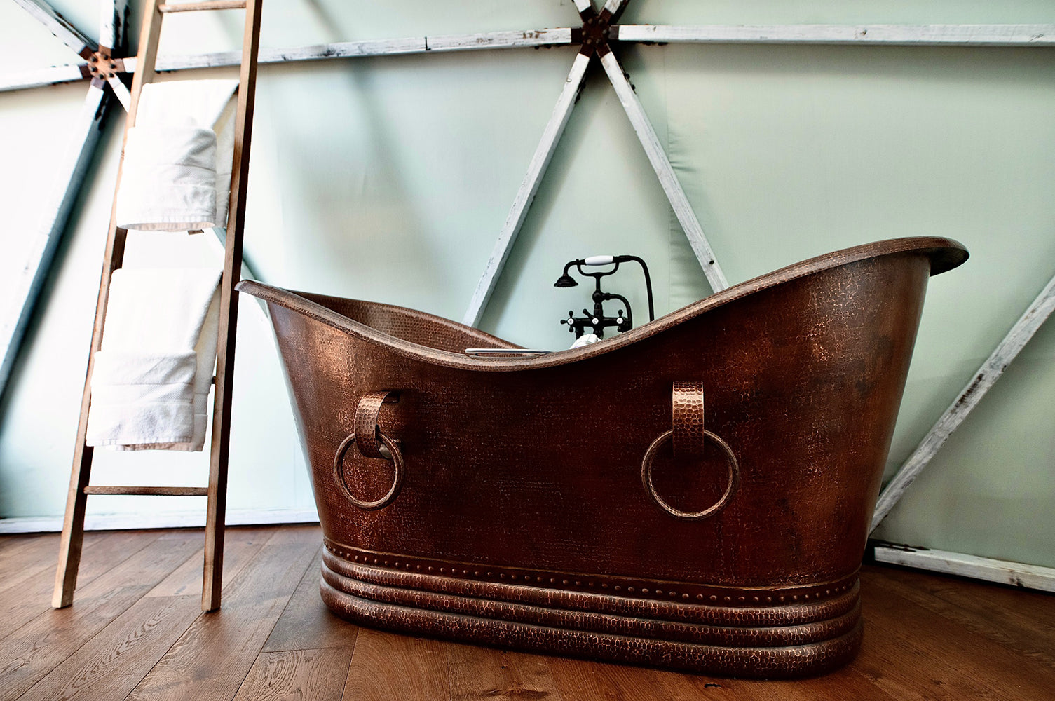 Installation Image of Premier Copper Products 67" Hammered Copper Double Slipper Bathtub With Rings, BTDR67DB