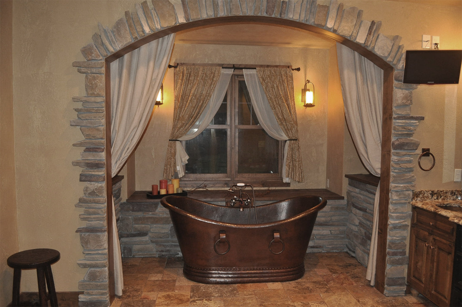 Installation Image of Premier Copper Products 67" Hammered Copper Double Slipper Bathtub With Rings, BTDR67DB