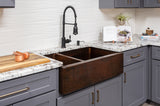 Installation Image of Premier Copper Products 33" Copper Farmhouse Sink, 25/75 Double Bowl, Oil Rubbed Bronze, KA25DB33229