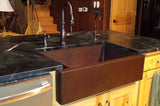 Installation Image of Premier Copper Products 33" Copper Farmhouse Sink, 30/70 Double Bowl, Oil Rubbed Bronze, KA30DB33229-SD5