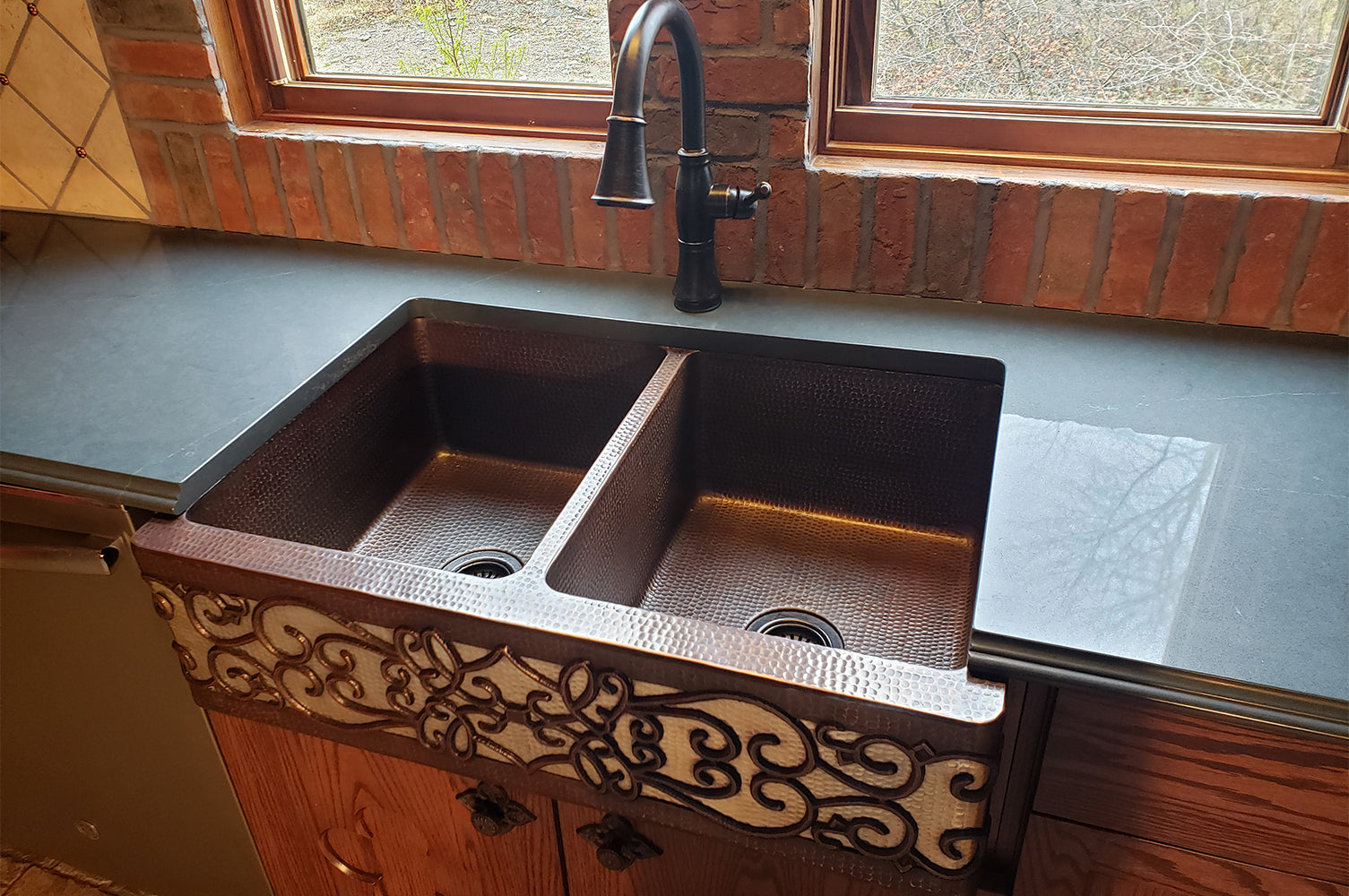 Installation Image of Premier Copper Products 33" Copper Farmhouse Sink, 50/50 Double Bowl, Oil Rubbed Bronze and Nickel, KA50DB33229S-NB