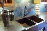 Installation Image of Premier Copper Products 33" Copper Farmhouse Sink, 50/50 Double Bowl, Oil Rubbed Bronze, KA50DB33229