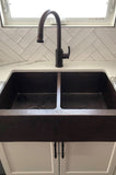 Installation Image of Premier Copper Products 33" Copper Farmhouse Sink, 50/50 Double Bowl, Oil Rubbed Bronze, KA50DB33229