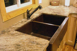 Installation Image of Premier Copper Products 33" Copper Farmhouse Sink, 50/50 Double Bowl, Oil Rubbed Bronze, KA50DB33229