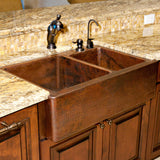 Installation Image of Premier Copper Products 33" Copper Farmhouse Sink, 60/40 Double Bowl, Oil Rubbed Bronze, KA60DB33229