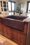 Installation Image of Premier Copper Products 30" Copper Farmhouse Sink, Oil Rubbed Bronze, KASDB30229