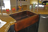 Installation Image of Premier Copper Products 33" Copper Farmhouse Sink, Oil Rubbed Bronze, KASDB33229