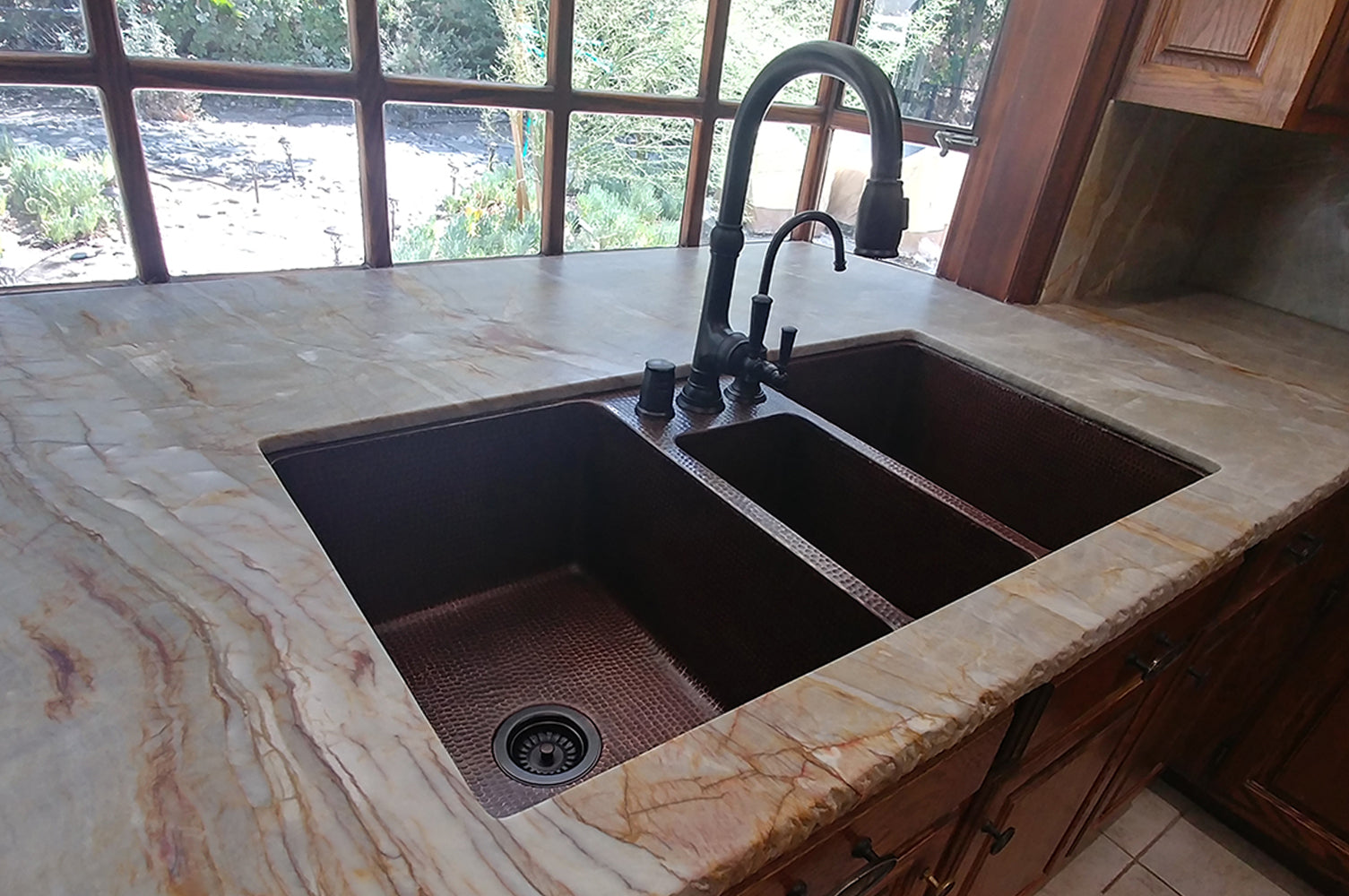 Installation Image of Premier Copper Products 42" Copper Kitchen Sink, 40/20/40 Triple Bowl, Oil Rubbed Bronze, KTDB422210