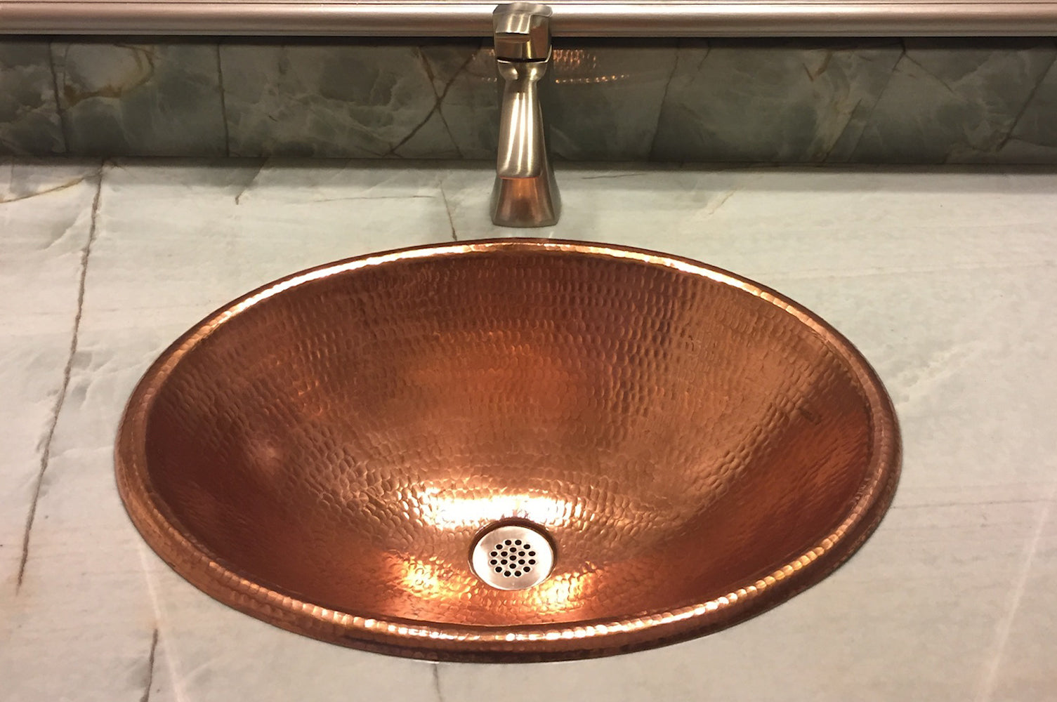 Installation Image of Premier Copper Products 19" Oval Copper Bathroom Sink, Polished Copper, LO19RPC
